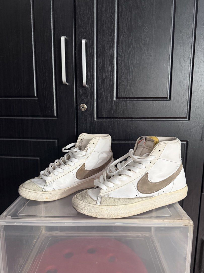 Nike Blazer Mid '77 Vintage White Brown (Category: Sneakers) located in Manila. Submitted by bianca.bobier (Listing ID 1464223234, Image 1). Description: - Classic Nike Blazer Mid '77 Vintage sneakers - White leather with brown accents - High-top design - White laces - Soles show some wear (selling as is) - Great for everyday wear.