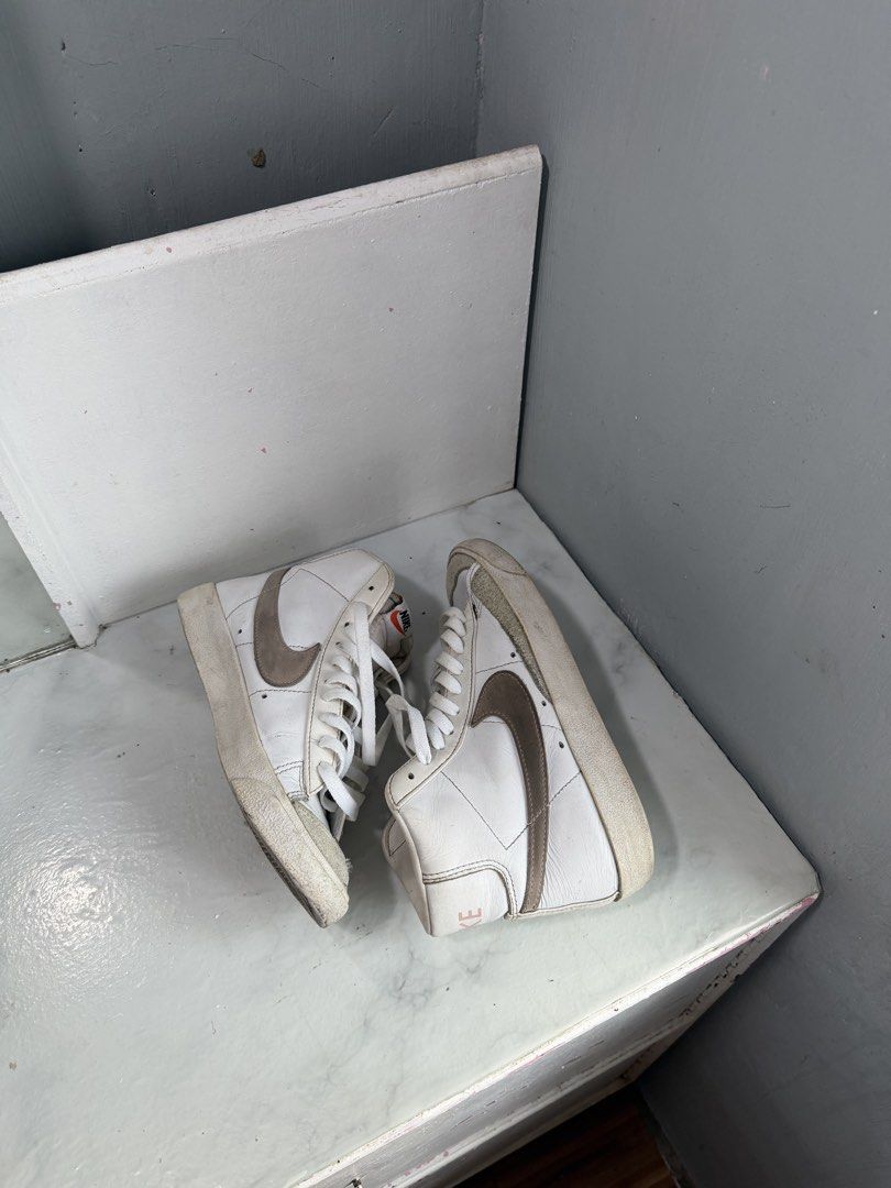 Nike Blazer Mid '77 Vintage White Brown (Category: Sneakers) located in Manila. Submitted by bianca.bobier (Listing ID 1464223234, Image 2). Description: - Classic Nike Blazer Mid '77 Vintage sneakers - White leather with brown accents - High-top design - White laces - Soles show some wear (selling as is) - Great for everyday wear.