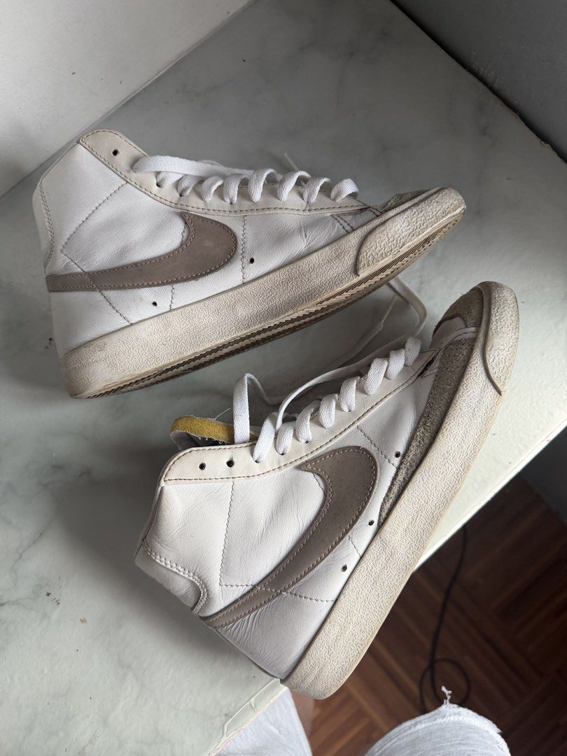 Nike Blazer Mid '77 Vintage White Brown (Category: Sneakers) located in Manila. Submitted by bianca.bobier (Listing ID 1464223234, Image 3). Description: - Classic Nike Blazer Mid '77 Vintage sneakers - White leather with brown accents - High-top design - White laces - Soles show some wear (selling as is) - Great for everyday wear.