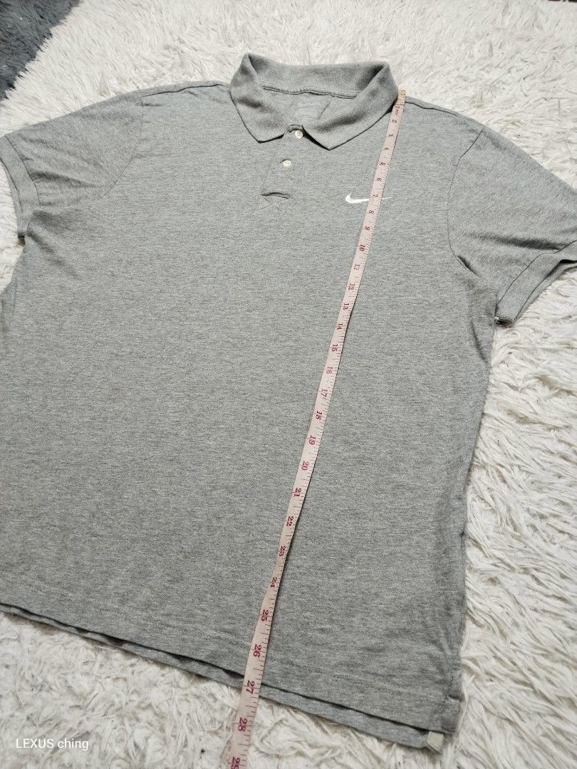 NIKE classic grey a two button placket and a small embroidered logo swoosh. (Category: Tshirts & Polo Shirts ) located in Manila. Submitted by lexusthrift1995 (Listing ID 1464225422, Image 3). Description: Size- XL on tag but fit to LARGE Dimension- 21x27 Color rate- 9/10 Condition-9/10 issue- stitch sa collar and faded print tag see last pics good condition ‼️300.pesos plus shipping fee 💸MODE OF PAYMENT- GCASH payment first 🚛MODE OF DELIVERY- 