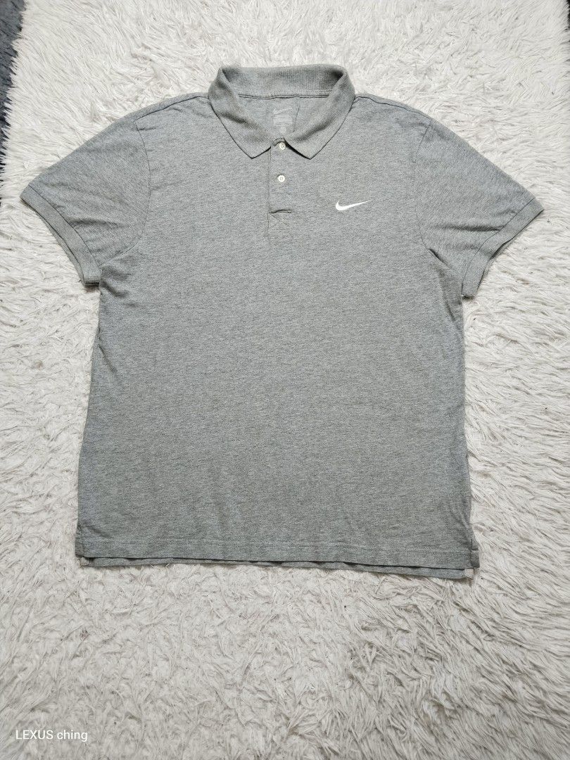 NIKE classic grey a two button placket and a small embroidered logo swoosh. (Category: Tshirts & Polo Shirts ) located in Manila. Submitted by lexusthrift1995 (Listing ID 1464225422, Image 1). Description: Size- XL on tag but fit to LARGE Dimension- 21x27 Color rate- 9/10 Condition-9/10 issue- stitch sa collar and faded print tag see last pics good condition ‼️300.pesos plus shipping fee 💸MODE OF PAYMENT- GCASH payment first 🚛MODE OF DELIVERY- 