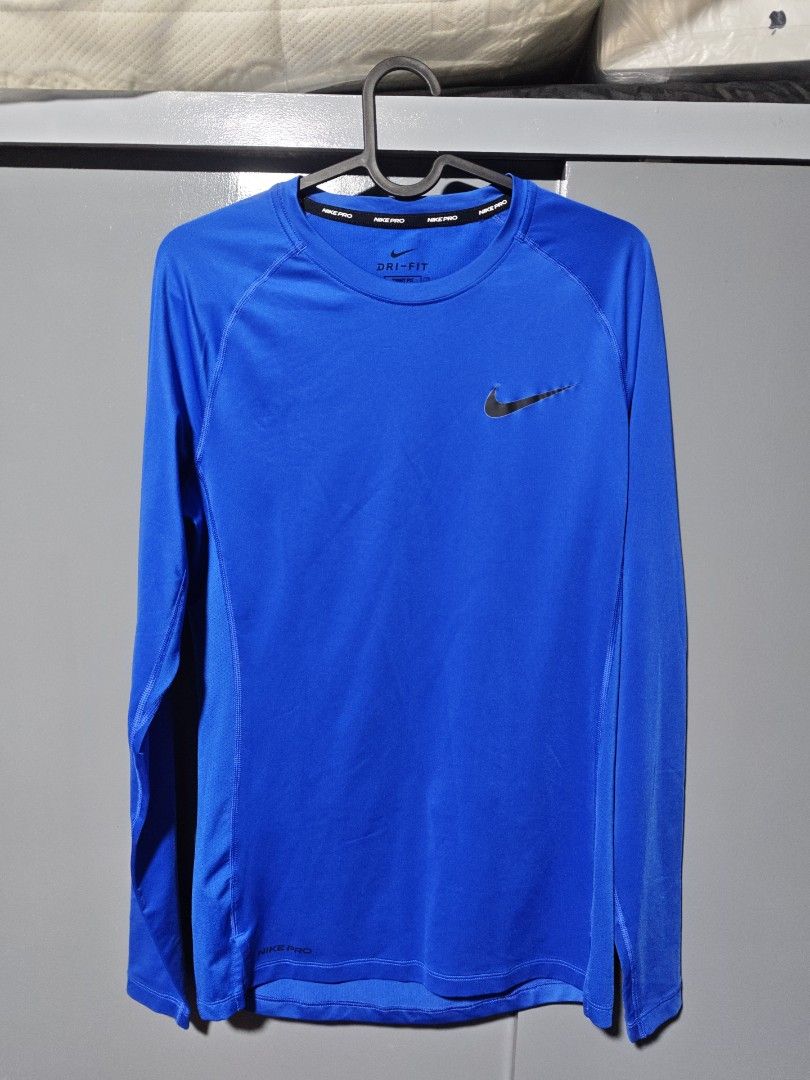NIKE COMPRESSION LONG SLEEVES (M) (Category: Activewear) located in Las Pinas. Submitted by mojoejoejoe2 (Listing ID 1464168976, Image 1). Description: - Blue Nike Dri-Fit T-shirt - Tight fit design - Made in Cambodia - Ideal for workouts or everyday wear - Comfortable and breathable fabric.