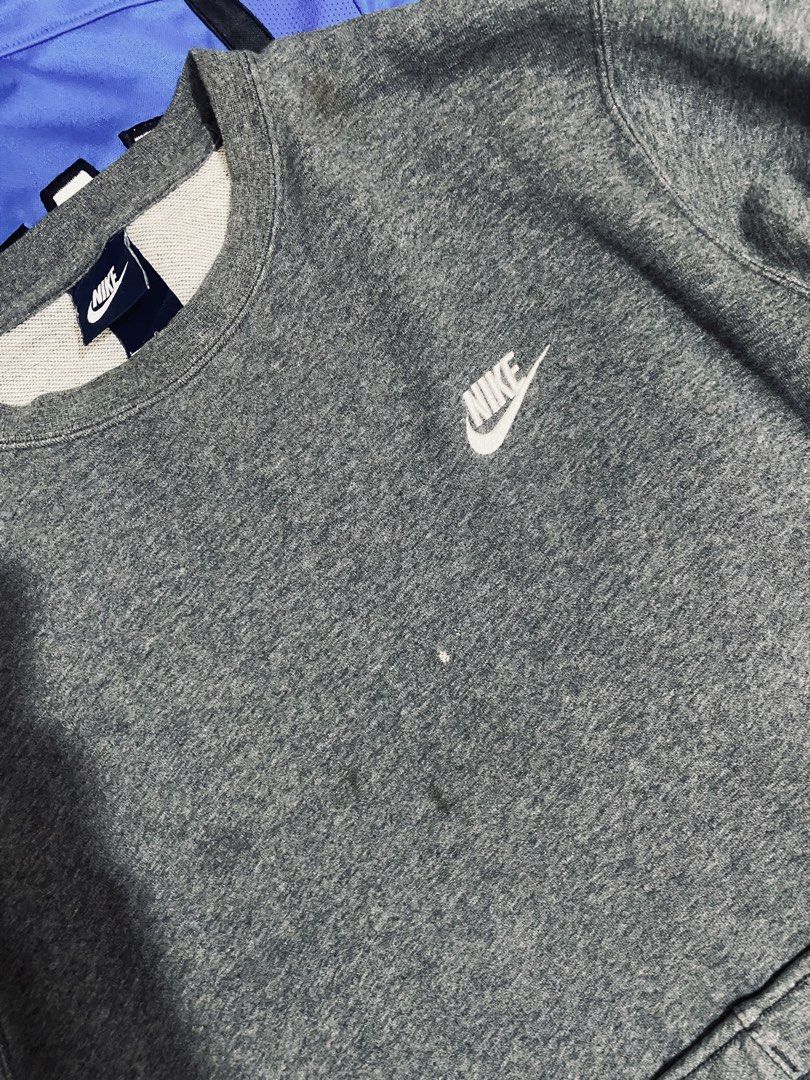 Nike Grey Sweatshirt and Joggers Set (Category: Coats, Jackets and Outerwear) located in Las Pinas. Submitted by johnpaul2525 (Listing ID 1464298100, Image 3). Description: - Grey Nike sweatshirt and matching joggers set - Features iconic Nike swoosh logo on both pieces - Sweatshirt has a few small marks on the front - Joggers also have a couple of small marks - Joggers feature a comfortable drawstring waist - Ideal for lounging or casual everyda