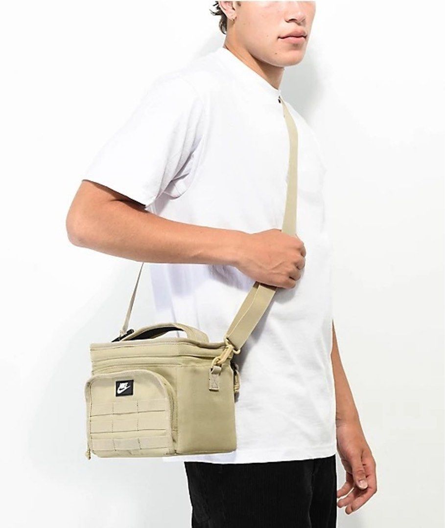 Nike Insulated Lunch Bag Tan (Category: Tote Bags) located in Quezon City. Submitted by jvr2019 (Listing ID 1464239169, Image 3). Description: - Brand new Nike insulated bag - Still has the tag attached - Front pocket with MOLLE webbing - Adjustable strap - Top zip opening - Ideal for lunches or small essentials.