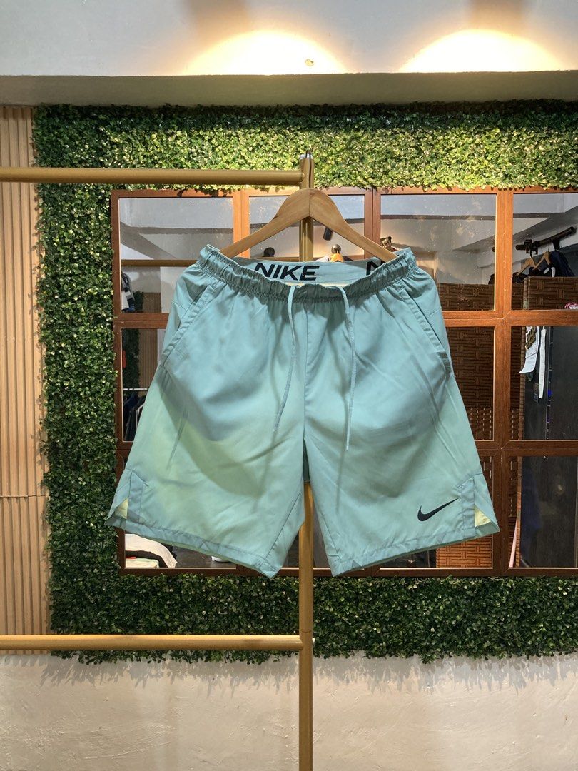 Nike Men's Running Shorts Light Green (Category: Shorts) located in Trece Martires City. Submitted by thriftkoto.91 (Listing ID 1464217493, Image 1). Description: - Light green Nike running shorts - Elastic waistband with drawstring - Two side pockets - Small Nike logo on left leg - Comfortable and breathable material - Ideal for workouts or casual wear.
