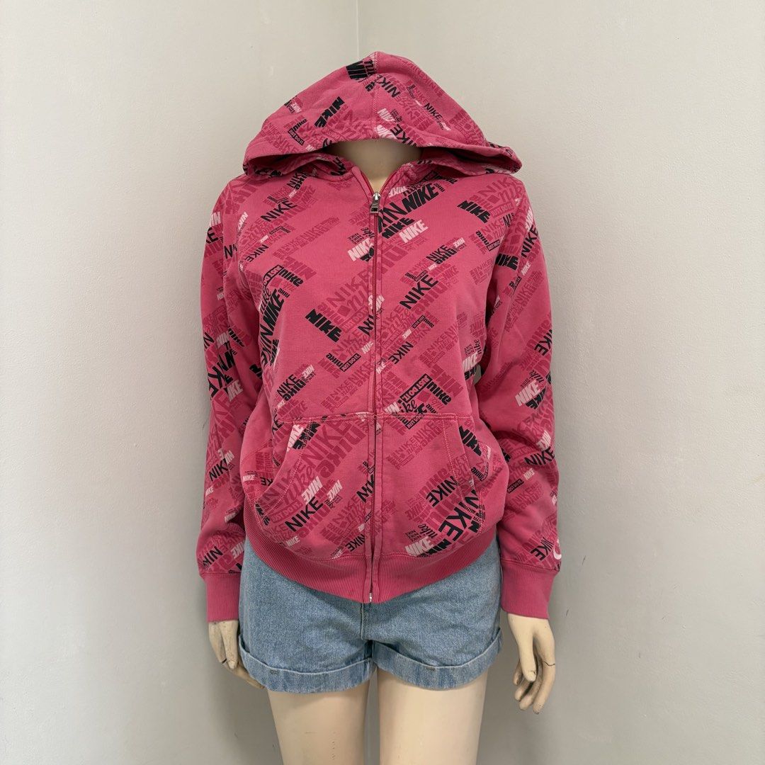 Nike Pink Zipper Hoodie Jacket (Category: Coats, Jackets and Outerwear) located in Imus. Submitted by reloved.nd (Listing ID 1464244444, Image 1). Description: - Adorable pink Nike hoodie - All-over Nike logo print - Full zip closure for easy wear - Convenient front pockets - Ideal for casual outings - Versatile styling with jeans or shorts - A must-have for Nike fans!.
