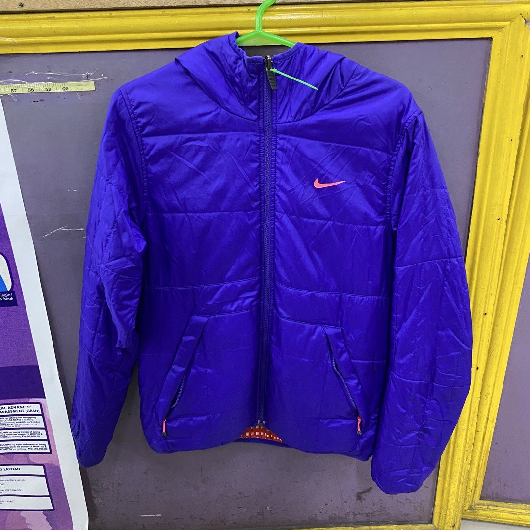 Nike Puffer Jacket / Hooded Winter Coat Purple with Orange Pattern Lining (Category: Coats, Jackets and Outerwear) located in Imus. Submitted by kingbhatsdrygoods (Listing ID 1464216628, Image 1). Description: KingBhats HUB Please read below before inquiring or making a purchase. ✨ 👕 ITEM DETAILS (Inches): • Shoulder: 18 • Width: 21.5 • Length: 26 • Sleeve Length: 27 • Flaws/Issues: pin hole 📌 ORDER & PAYMENT RULE: • First to pay, first served.