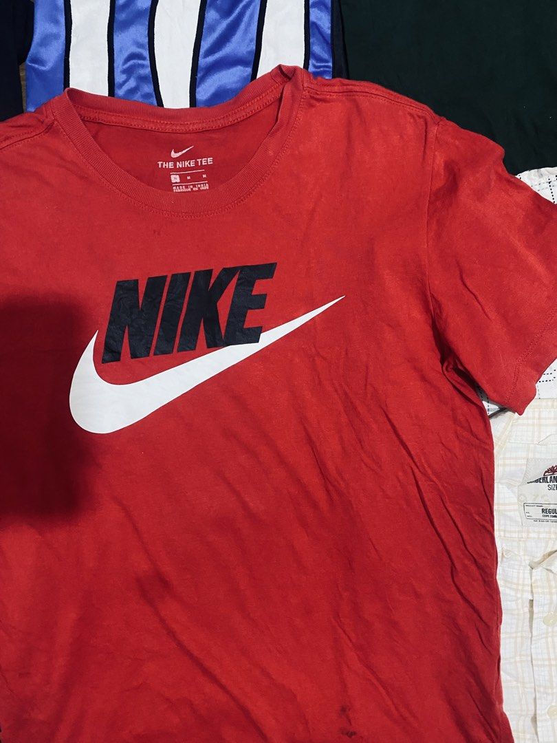 Nike Red T-Shirt (Category: Tshirts & Polo Shirts ) located in Las Pinas. Submitted by johnpaul2525 (Listing ID 1464299010, Image 2). Description: - Classic red Nike t-shirt - Features the iconic Nike logo on the front - Made from comfortable fabric, perfect for casual wear - Size: Medium (M) - Check out other items in the photos!.