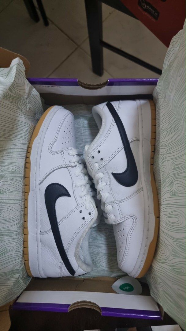 Nike SB Dunk Low Pro White Black Gum (Category: Sneakers) located in Baguio. Submitted by jeikei27 (Listing ID 1464209639, Image 2). Description: - Classic Nike SB Dunks - White leather upper with black swoosh - Gum sole for excellent grip - Comes with original purple Nike SB box - Ideal for skating or everyday wear - Clean and simple design.