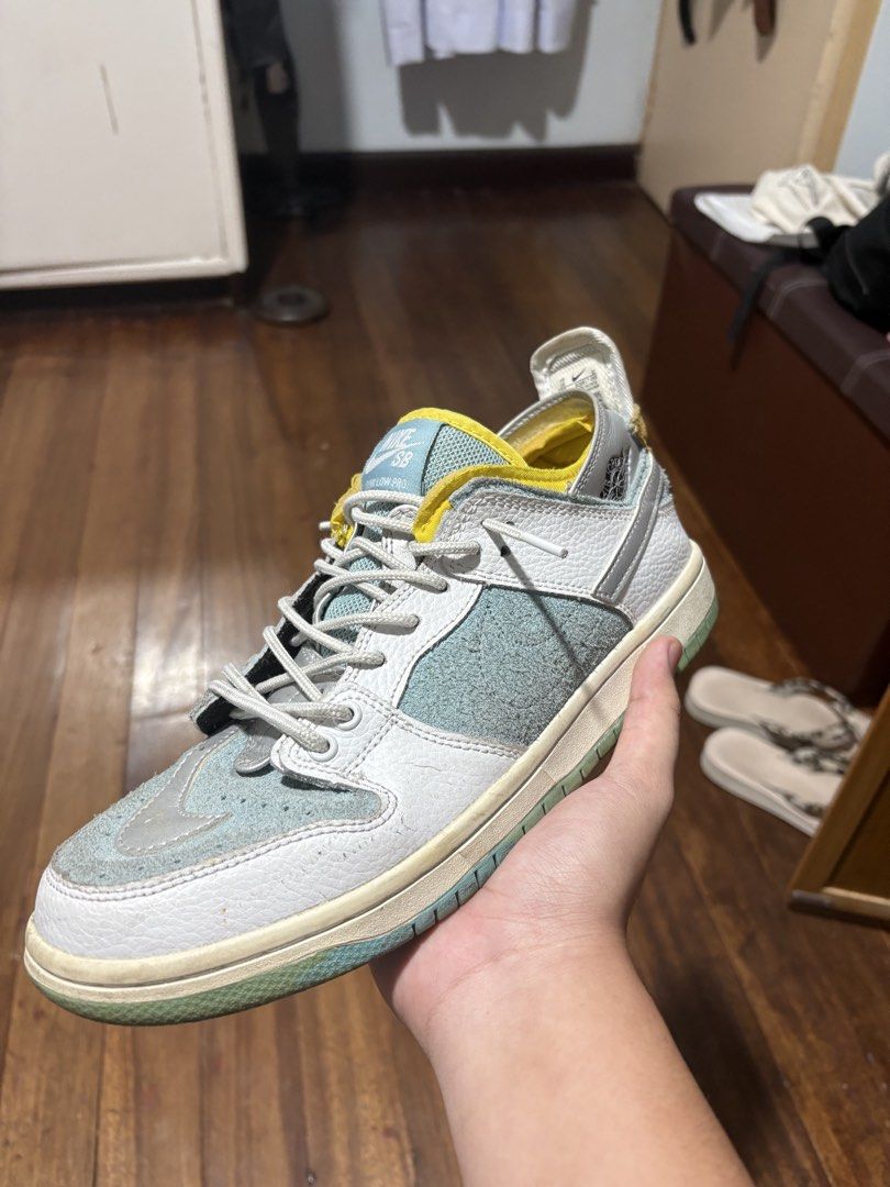Nike SB Dunk Low Pro White Teal Grey Yellow (Category: Sneakers) located in Manila. Submitted by safeeagle-776d16 (Listing ID 1464280421, Image 2). Description: - Nike SB Dunk Low Pro sneakers - White leather base with teal suede overlays - Yellow and light blue accents on tongue and sole - Grey laces - Pre-owned, please check photos for condition details.