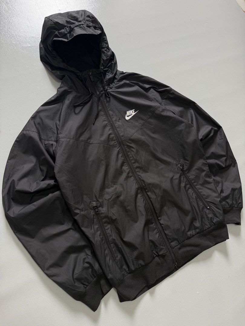 NIKE SPORTSWEAR WIND RUNNER JACKET (Category: Coats, Jackets and Outerwear) located in Cavite. Submitted by chooseyouroutfit (Listing ID 1464300169, Image 1). Description: NIKE SPORTSWEAR WIND RUNNER HOODED JACKET Wind breaker Black na black Length - 24 Width - 21.5 Excellent condition Issue: scratch ribbings only.