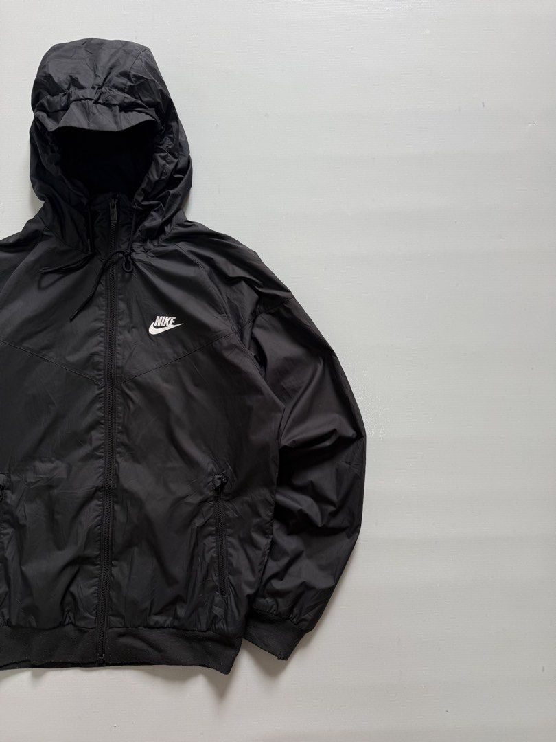 NIKE SPORTSWEAR WIND RUNNER JACKET (Category: Coats, Jackets and Outerwear) located in Cavite. Submitted by chooseyouroutfit (Listing ID 1464300169, Image 3). Description: NIKE SPORTSWEAR WIND RUNNER HOODED JACKET Wind breaker Black na black Length - 24 Width - 21.5 Excellent condition Issue: scratch ribbings only.