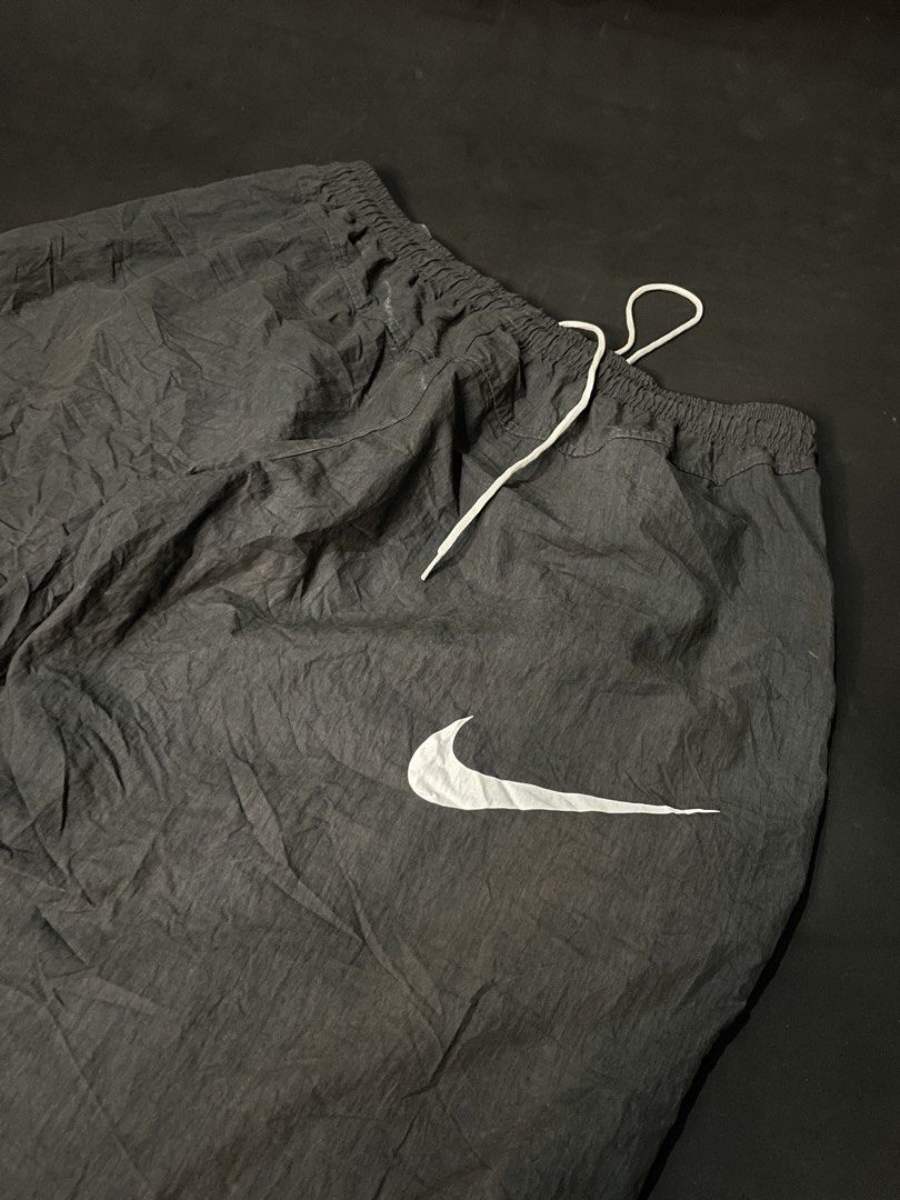 Nike Stussy Track Pants (Category: Joggers) located in Cebu City. Submitted by grand_kian (Listing ID 1464279548, Image 3). Description: Black track pants with Nike and Stussy branding. Elastic waistband with drawstring. Adjustable cuffs. Great for casual wear or sports..
