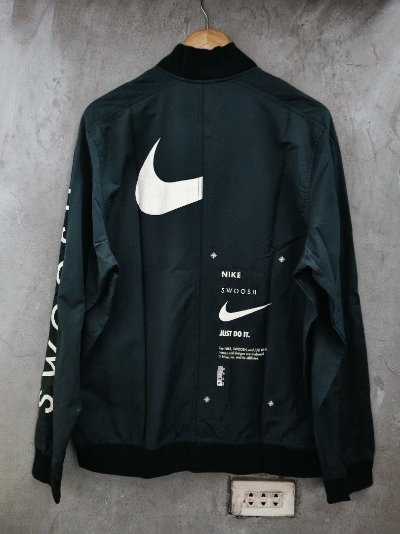 NIKE SWOOSH (Category: Coats, Jackets and Outerwear) located in Masbate. Submitted by arielagost83627 (Listing ID 1464224791, Image 2). Description: Color Rate: 9.5/10 Dimes: 23x28 Issue: None Excellent Condition.