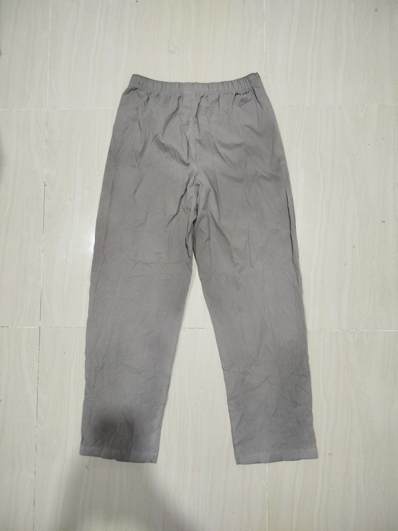 Nike Tech Pack Dri-Fit Grey Track Pants Size M (Category: Joggers) located in Aroroy. Submitted by dr0p-a-dr1p (Listing ID 1464207359, Image 2). Description: Waist: 30-34 Length: 40 - Grey Nike Tech Pack Pants - Dri-Fit material for comfort and performance - Elastic waistband with adjustable drawstring - Size: Medium (M) - Made in Vietnam - Versatile: Perfect for workouts or everyday casual wear - Please check photos for detailed condition..