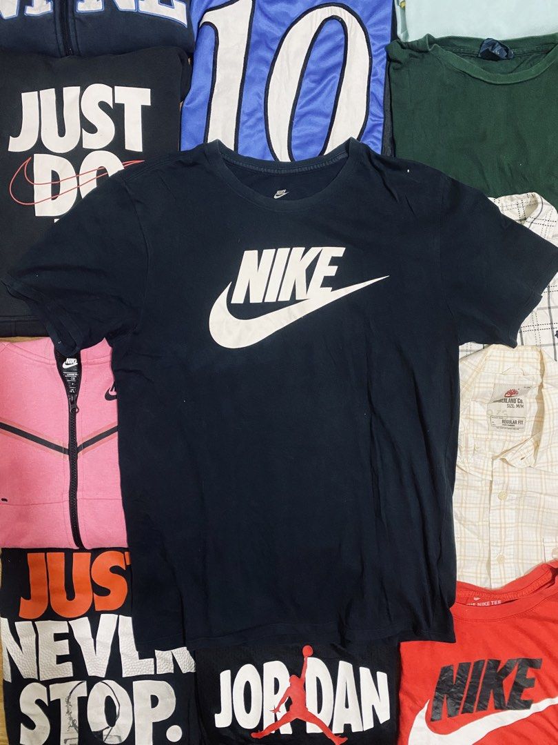 Nike T-Shirt (Category: Tshirts & Polo Shirts ) located in Las Pinas. Submitted by johnpaul2525 (Listing ID 1464298812, Image 1). Description: - Classic black Nike t-shirt - Features iconic white Nike swoosh logo on the front - Made from comfortable fabric - Ideal for casual wear or workouts - Easy to pair with any outfit - Essential Nike top.