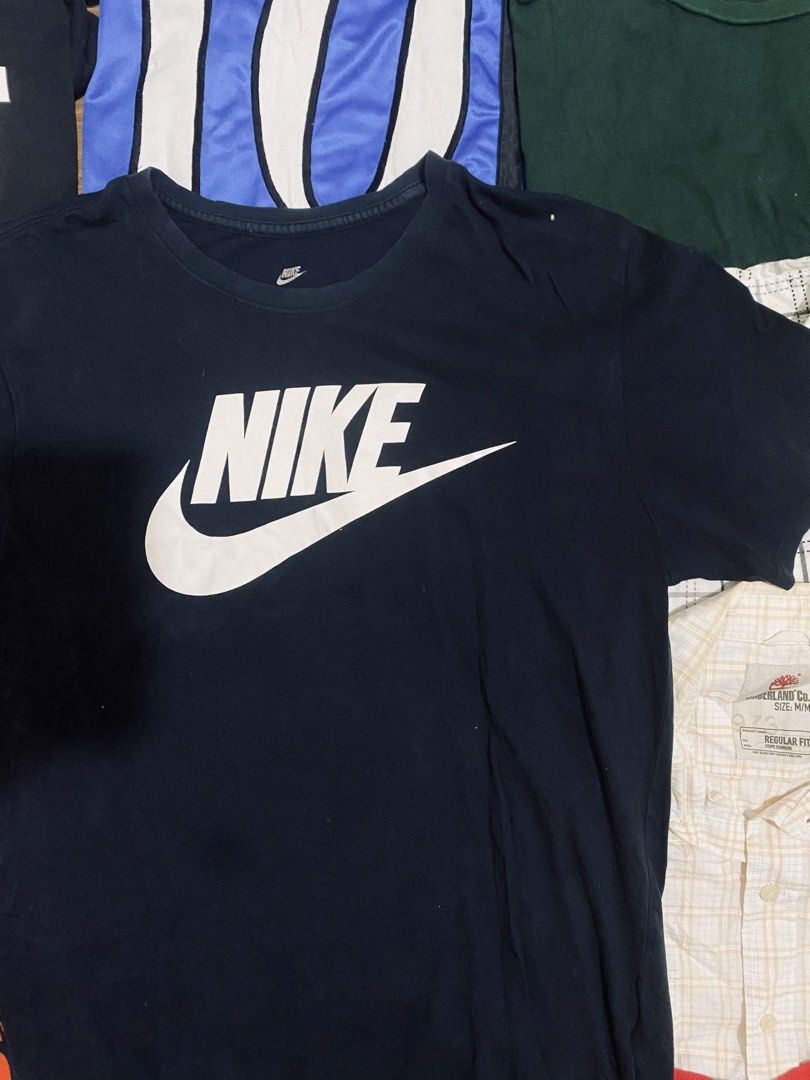 Nike T-Shirt (Category: Tshirts & Polo Shirts ) located in Las Pinas. Submitted by johnpaul2525 (Listing ID 1464298812, Image 2). Description: - Classic black Nike t-shirt - Features iconic white Nike swoosh logo on the front - Made from comfortable fabric - Ideal for casual wear or workouts - Easy to pair with any outfit - Essential Nike top.