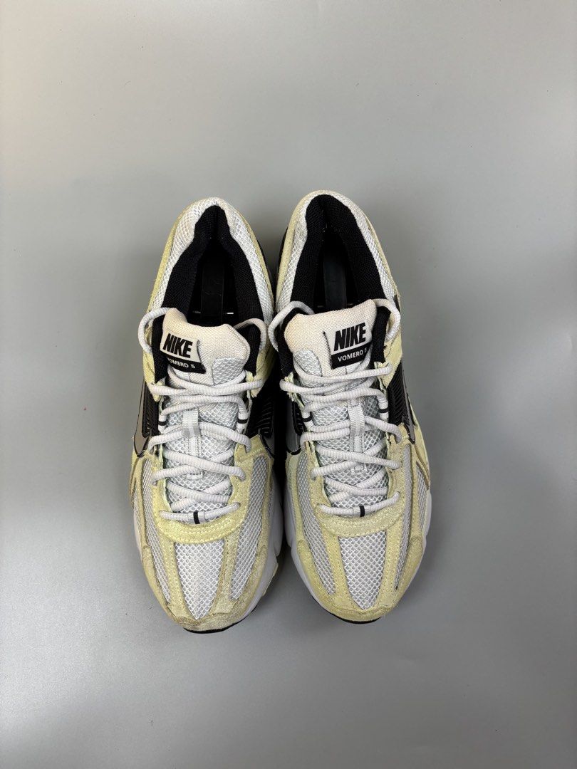 Nike Vomero 5 "Photon Dust" "Light Lemon Twist" (Category: Sneakers) located in Cagayan de Oro. Submitted by klebertaco53763 (Listing ID 1464159935, Image 2). Description: - Nike Vomero 5 - Colorway: Photon Dust and Light Lemon Twist - Materials: Breathable mesh upper with premium suede overlays - Accents: Stylish black and silver details - Features: Unique textured heel counter for added flair - Laces: Clean white laces - Versatile: Ideal for bo