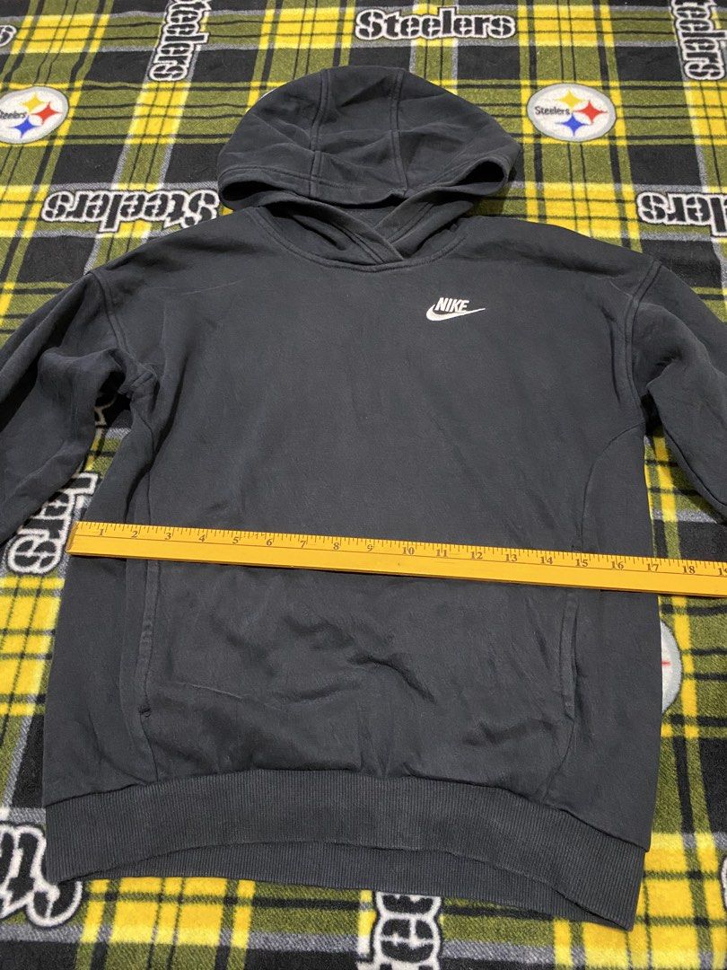 NIKE,Pullover hoodie (Kids) (Category: Babies & Kids Fashion) located in Cavite. Submitted by jc_thrift95 (Listing ID 1464174198, Image 3). Description: - a classic black Nike pullover hoodie featuring a small embroidered white Swoosh logo on the chest. - Made in Cambodia - Color rate 8/10 - See pictures details for dimes..