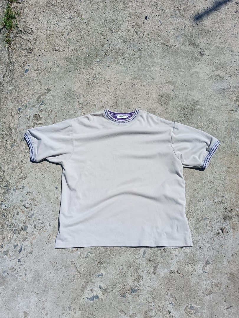 Niko and... T-shirt (Category: Tshirts & Polo Shirts ) located in Urdaneta. Submitted by tetsudoubletaps (Listing ID 1464159540, Image 1). Description: - Brand: Niko and... - Color: Grey - Size: L - Design: Purple and white striped trim on collar and sleeves - Material: Polyester and Polyurethane - Occasion: Casual wear.