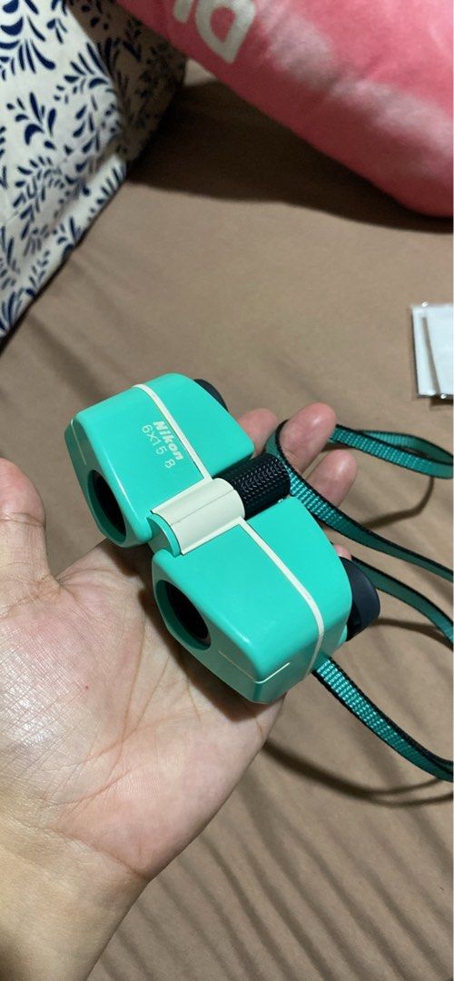 Nikon 6x15 8 Compact Binoculars Teal (Category: Hiking & Camping) located in Manila. Submitted by cdb_22 (Listing ID 1464187966, Image 3). Description: - Teal Nikon 6x15 8 binoculars - Compact and lightweight design - Easy to carry, perfect for on-the-go - Ideal for outdoor activities and bird watching - In good working condition - Comes with a strap.