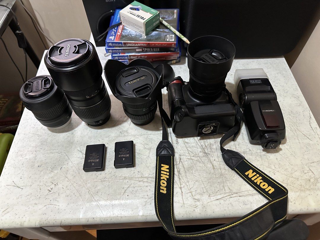 Nikon DSLR Camera with Lenses, Flash, and Battery Grip (Category: Cameras) located in Manila. Submitted by olxph_jeffr6014 (Listing ID 1464140801, Image 2). Description: - Nikon DSLR Camera D3100 - Tamron Lens - Tokina Lens - Yongnuo Flash - Battery Grip - 2 x Nikon Memory Cards - Original Nikon Strap - Ideal for photography enthusiasts.