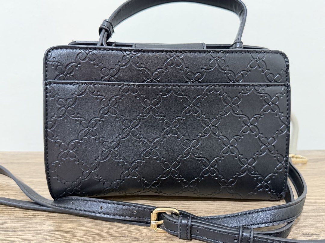 Nine West Maribel Mini Black Monogram Top Handle Bag (Category: Luxury Bags & Wallets) located in Magalang. Submitted by xeevain (Listing ID 1464308374, Image 2). Description: - Brand new Nine West Maribel Mini bag - All-over Nine West monogram pattern - Top handle and detachable shoulder strap - Elegant gold hardware details - Includes original tag - Lined interior with a central compartment -Take note that there is a minimal crease on the handl