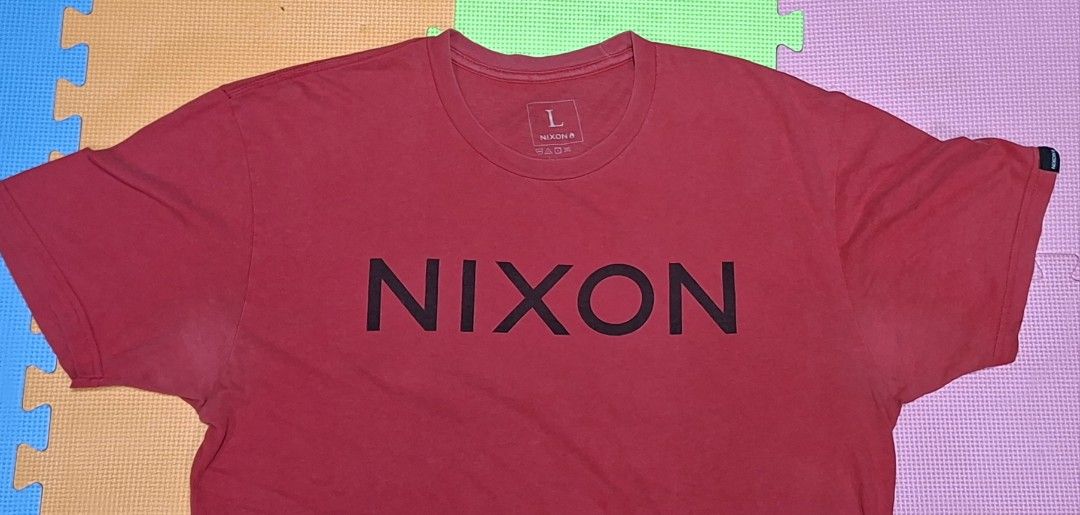 NIXON Red T-Shirt Size L (Category: Tshirts & Polo Shirts ) located in Manila. Submitted by declutrredgoods (Listing ID 1464282620, Image 2). Description: - Red NIXON T-shirt - Size: Large (L) - Features the classic NIXON logo across the chest - Ideal for casual everyday wear - Please check photos for detailed condition.