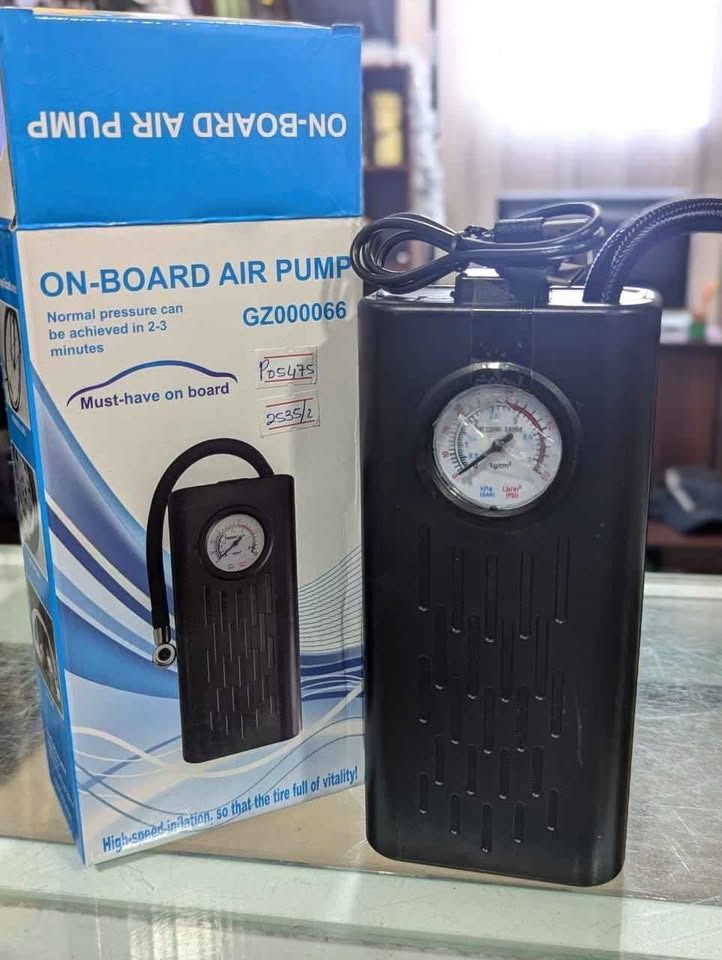 On-Board Air Pump (model GZ000066) (Category: Home Improvement Tools & Accessories) located in Manila. Submitted by acbdiane (Listing ID 1464196988, Image 2). Description: On-Board Air Pump (model GZ000066) Product Details Type: Portable digital/analog tire inflator Model Number: GZ000066 Power Source: Rechargeable via Type-C USB cable Features: Built-in pressure gauge, flexible air hose, and assorted nozzle attachments for balls and inflatables.