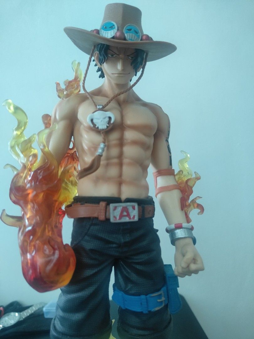 One Piece Portgas D. Ace Flame Effect Figure (Category: Figurines & Statues) located in Pasig City. Submitted by aquarian121424 (Listing ID 1464198716, Image 1). Description: - Awesome One Piece Ace Figure! - 40 cm height - Features a cool flame effect. - Detailed base with rocks and fire. - Comes with an alternate head. - A must-have for any One Piece fan's collection. - no box,.