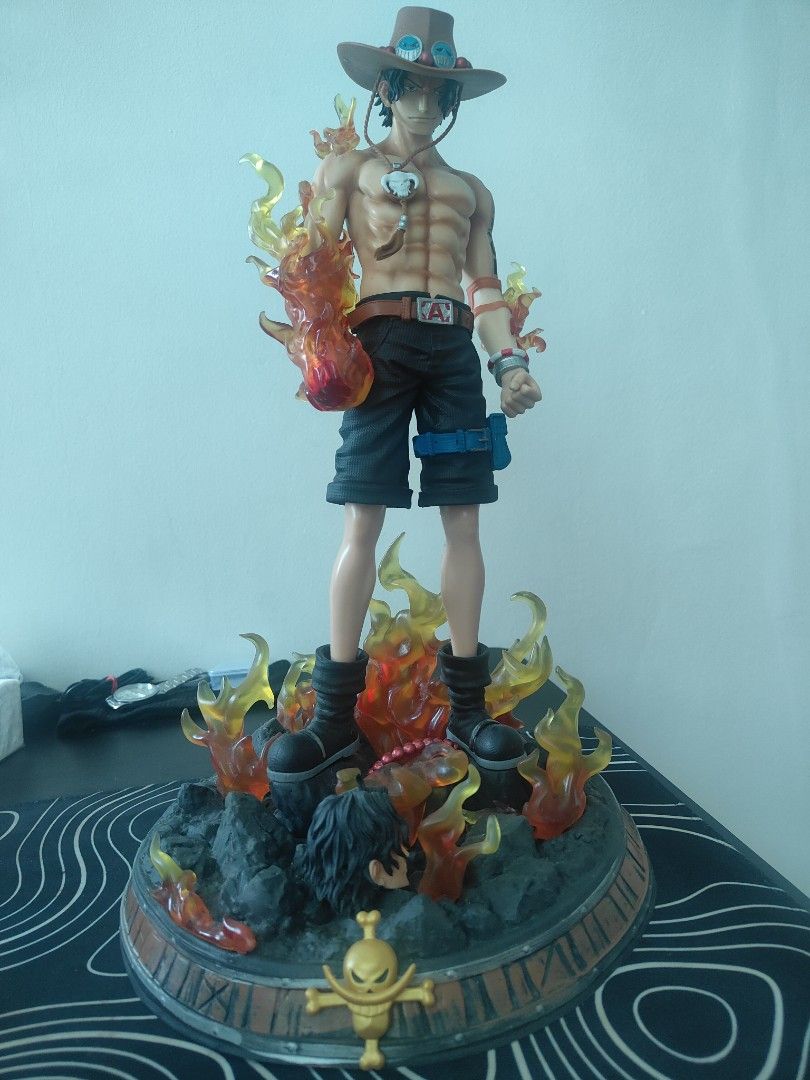 One Piece Portgas D. Ace Flame Effect Figure (Category: Figurines & Statues) located in Pasig City. Submitted by aquarian121424 (Listing ID 1464198716, Image 3). Description: - Awesome One Piece Ace Figure! - 40 cm height - Features a cool flame effect. - Detailed base with rocks and fire. - Comes with an alternate head. - A must-have for any One Piece fan's collection. - no box,.
