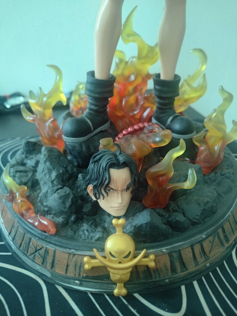One Piece Portgas D. Ace Flame Effect Figure (Category: Figurines & Statues) located in Pasig City. Submitted by aquarian121424 (Listing ID 1464198716, Image 2). Description: - Awesome One Piece Ace Figure! - 40 cm height - Features a cool flame effect. - Detailed base with rocks and fire. - Comes with an alternate head. - A must-have for any One Piece fan's collection. - no box,.