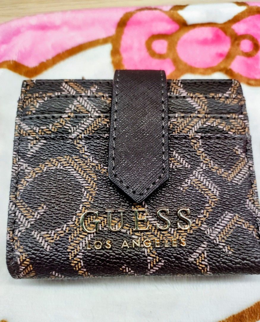 Original Guess Bifold Wallet (Category: Wallets & Card holders) located in General Trias. Submitted by dexieshop (Listing ID 1464156182, Image 1). Description: *Authentic Guess Bifold Short Wallet * Bought US *Payment via Gcash, No COD *Delivery via J&T, Grab or Lalamove *Shipping Fee c/o Buyer.