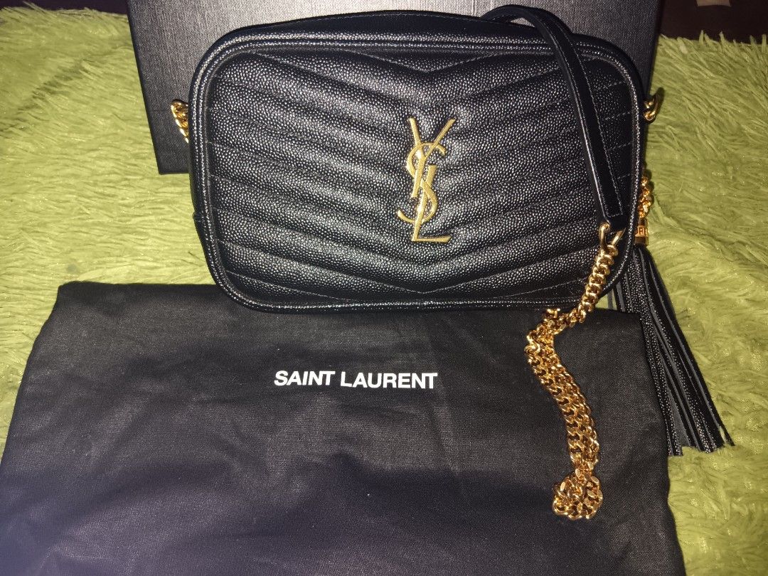 Original YSL mini Lou camera bag (Category: Luxury Bags & Wallets) located in Manila. Submitted by zstoreph (Listing ID 1464078707, Image 1). Description: - Authentic Saint Laurent camera bag calf leather grained material - Black chevron - Gold hardware - Signature YSL logo - Tassel detail - Chain strap - Comes with original box - Versatile for everyday or evening wear willing to meet up check first,This is good condition like new. 100% original.