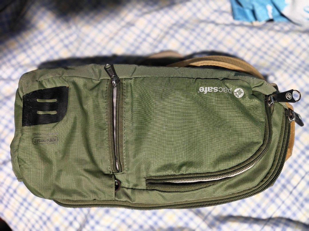 Pacsafe Venturesafe 150cm Sling pack Olive Green (Category: Sling Bags) located in Quezon City. Submitted by bagsareus428 (Listing ID 1464318802, Image 3). Description: - Pacsafe Venturesafe sling bag - Color: Olive Green - Features multiple zippered compartments for organization - Adjustable and padded strap for comfort - Ideal for travel or everyday use 3 zip compartments multiple zip organizers inside top hook handle RFID water resistant light