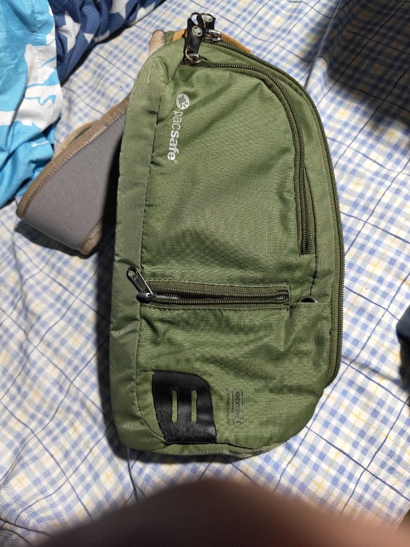 Pacsafe Venturesafe 150cm Sling pack Olive Green (Category: Sling Bags) located in Quezon City. Submitted by bagsareus428 (Listing ID 1464318802, Image 1). Description: - Pacsafe Venturesafe sling bag - Color: Olive Green - Features multiple zippered compartments for organization - Adjustable and padded strap for comfort - Ideal for travel or everyday use 3 zip compartments multiple zip organizers inside top hook handle RFID water resistant light