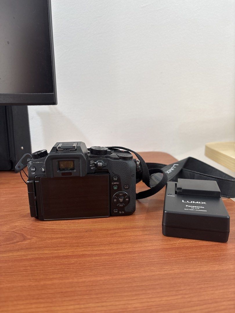 Panasonic Lumix G Mirrorless Camera with Lens (Category: Cameras) located in Quezon City. Submitted by mynameismio (Listing ID 1464158256, Image 2). Description: - Panasonic Lumix G camera - Includes lens - Comes with battery charger - Ideal for both photos and videos - Ready to capture your moments - Attached strap - Lens cap included.