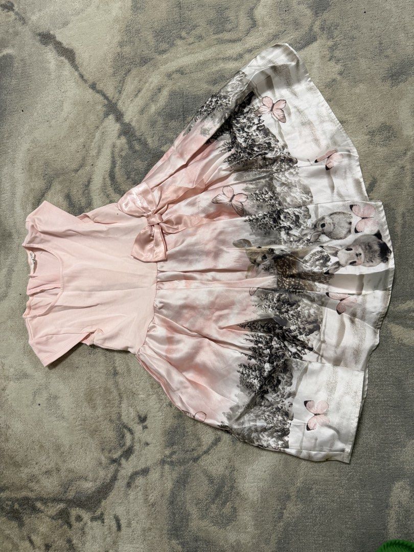 Pink Birthday Dress (Category: Babies & Kids Fashion) located in Manila. Submitted by e.louise (Listing ID 1464331507, Image 2). Description: - Adorable pink dress - Features a charming butterfly and forest print on the skirt - Convenient back zipper closure - Sweet bow detail on the front - Comfortable short sleeves - Ideal for parties and special occasions.