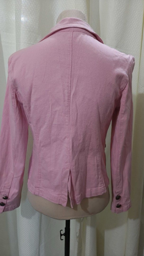 Pink Button-Up Blazer Jacket (Category: Coats, Jackets and Outerwear) located in Taguig. Submitted by ymicloset (Listing ID 1464233550, Image 3). Description: - Cute pink blazer - Classic lapel style - Three buttons down the front - Two flap pockets - Versatile for casual or dressy occasions - Long sleeves with button details at cuffs - Back vent for easy movement -Cotton denim fabric - Waist 32 in -Shoulder 16 in -Length 20 in.