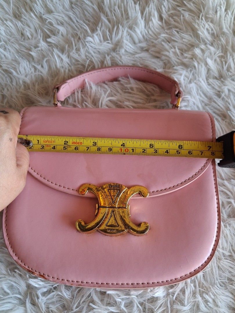 Pink Celine Triomphe Bag (Category: Luxury Bags & Wallets) located in Agoncillo. Submitted by vinsoy07 (Listing ID 1464163732, Image 2). Description: - Cute pink handbag - Elegant gold hardware - Iconic Triomphe clasp - Interior zip pocket for secure storage - Approximately 7 inches tall - Ideal for carrying your daily essentials - Selling because it's no longer frequently used.