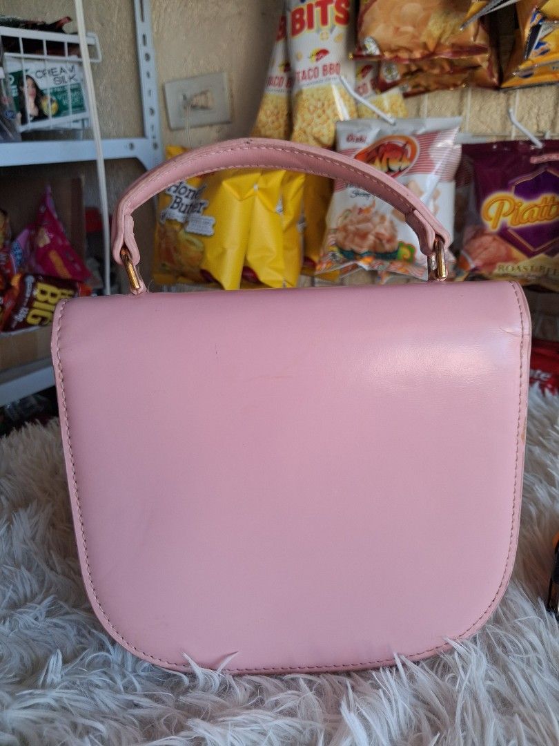 Pink Celine Triomphe Bag (Category: Luxury Bags & Wallets) located in Agoncillo. Submitted by vinsoy07 (Listing ID 1464163732, Image 3). Description: - Cute pink handbag - Elegant gold hardware - Iconic Triomphe clasp - Interior zip pocket for secure storage - Approximately 7 inches tall - Ideal for carrying your daily essentials - Selling because it's no longer frequently used.