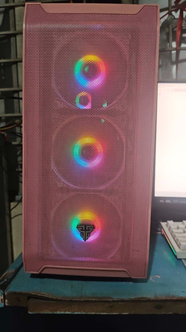 Pink Gaming PC Setup - Ryzen 5, GTX 1050 Ti (Category: Desktops) located in Pasig City. Submitted by jhaminocencio08 (Listing ID 1464338845, Image 2). Description: Selling my beloved pink gaming PC setup. It's well-maintained and ready for gaming. Specs include AMD Ryzen 5 3400G, Gigabyte B450M DS3H V2 motherboard, PNY XLR8 Epic-X RGB 16GB DDR4 RAM, NVIDIA GeForce GTX 1050 Ti GPU, WD Green 120GB SSD, WD Blue 1TB HDD, and WD SN520 256GB NVMe. Powe