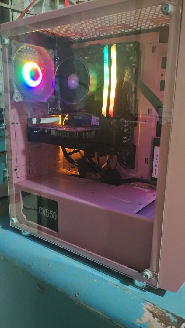 Pink Gaming PC Setup - Ryzen 5, GTX 1050 Ti (Category: Desktops) located in Pasig City. Submitted by jhaminocencio08 (Listing ID 1464338845, Image 1). Description: Selling my beloved pink gaming PC setup. It's well-maintained and ready for gaming. Specs include AMD Ryzen 5 3400G, Gigabyte B450M DS3H V2 motherboard, PNY XLR8 Epic-X RGB 16GB DDR4 RAM, NVIDIA GeForce GTX 1050 Ti GPU, WD Green 120GB SSD, WD Blue 1TB HDD, and WD SN520 256GB NVMe. Powe