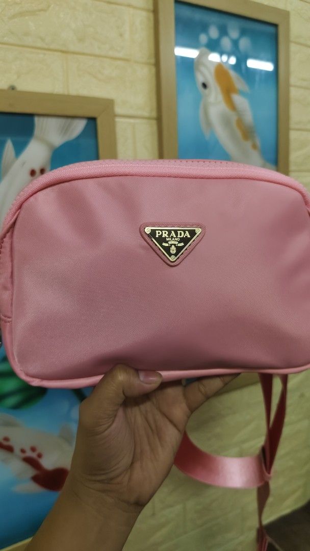 Pink Prada Nylon Crossbody Bag (Category: Luxury Bags & Wallets) located in Antipolo. Submitted by robannrave98496 (Listing ID 1464297590, Image 1). Description: - Cute pink Prada crossbody bag/beltbag - Durable nylon material - Adjustable strap with Prada branding - Secure zipper closure - Interior zip pocket and card slots - Ideal for everyday use or travel - Comes with authenticity card.