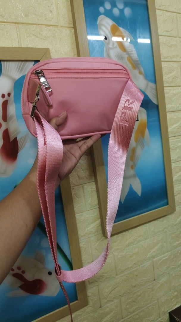 Pink Prada Nylon Crossbody Bag (Category: Luxury Bags & Wallets) located in Antipolo. Submitted by robannrave98496 (Listing ID 1464297590, Image 2). Description: - Cute pink Prada crossbody bag/beltbag - Durable nylon material - Adjustable strap with Prada branding - Secure zipper closure - Interior zip pocket and card slots - Ideal for everyday use or travel - Comes with authenticity card.