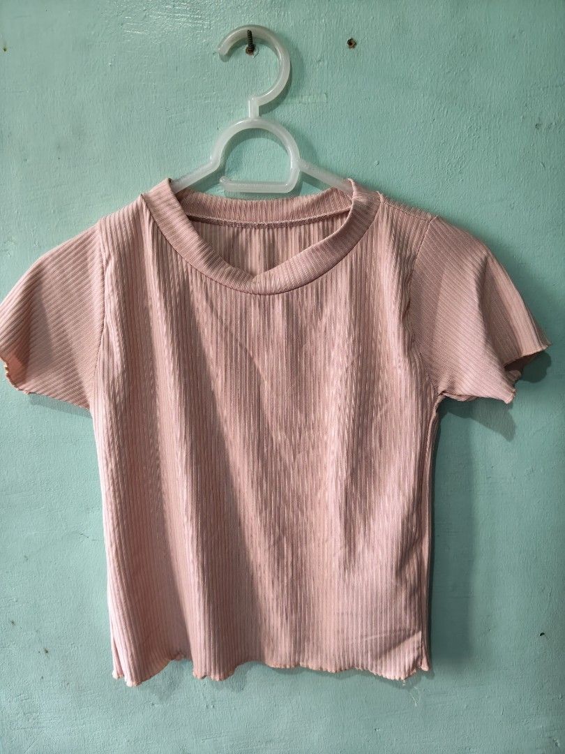 Pink Ribbed Cropped T-shirt (Category: Shirts) located in Mandaluyong City. Submitted by locolady (Listing ID 1464164152, Image 1). Description: - Adorable pink ribbed t-shirt - Features short sleeves with a cute lettuce hem - Made from very stretchy material for a comfortable fit - Versatile piece: pairs perfectly with high-waisted jeans or skirts - Ideal for easy, casual outings.