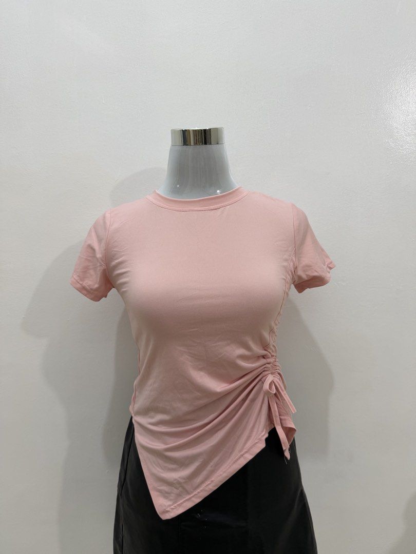 Pink Ruched Side Tie T-shirt (Category: Shirts) located in Manila. Submitted by e.louise (Listing ID 1464334623, Image 2). Description: - Adorable pink t-shirt - Features a stylish ruched side tie detail - Short sleeves and classic crew neck - Made from soft and stretchy fabric for comfort - Ideal for everyday casual wear - Easily pairs with jeans or skirts.