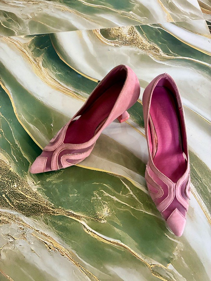 Pink Suede Mesh Pointed Toe Heels (Category: Heels) located in Tabuk. Submitted by twotimestooo (Listing ID 1464175324, Image 3). Description: - Stunning pink suede heels - Elegant mesh detailing - Unique curved heel design - Pointed toe for a sophisticated look - Ideal for dressing up any outfit - Minor scuffs on soles and heels.