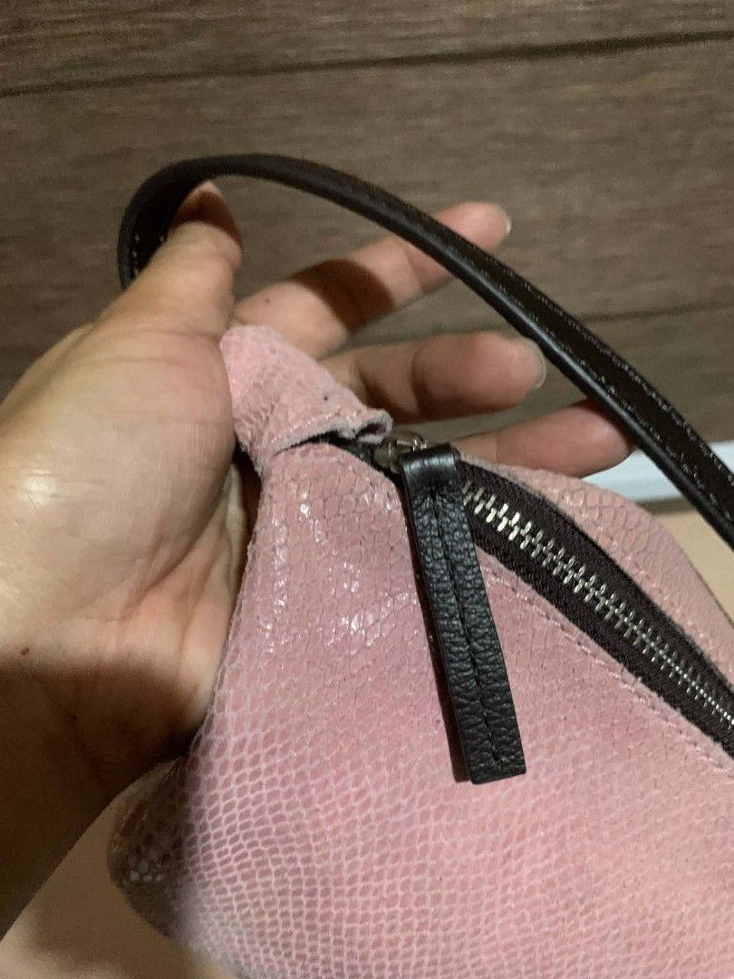 Pink Textured Shoulder Bag with Black Straps (Category: Shoulder Bags) located in Aliaga. Submitted by akishaoshop2010. (Listing ID 1464139437, Image 3). Description: - Adorable pink shoulder bag - Unique textured material resembling snakeskin - Secure zipper closure - Stylish black straps - Compact size, ideal for carrying essentials - Perfect for casual outings and everyday use.