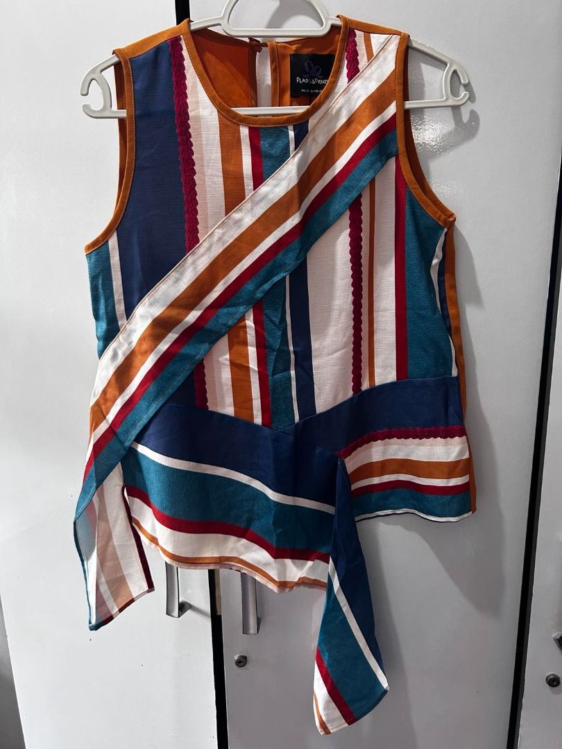 Plains & Prints Asymmetric Striped Top (Category: Sleeveless) located in Pasig City. Submitted by ladyleslieisletavelarde4902 (Listing ID 1464140073, Image 1). Description: Elegant sleeveless top featuring multi-pattern stripes, woven braided accents, and a diagonal sash tie. Very classy and perfect for smart-casual wear, office days, or events Brand: Plains & Prints Tag Size: XS / Fits XS to S Purchase direct from store. Never been used with tag